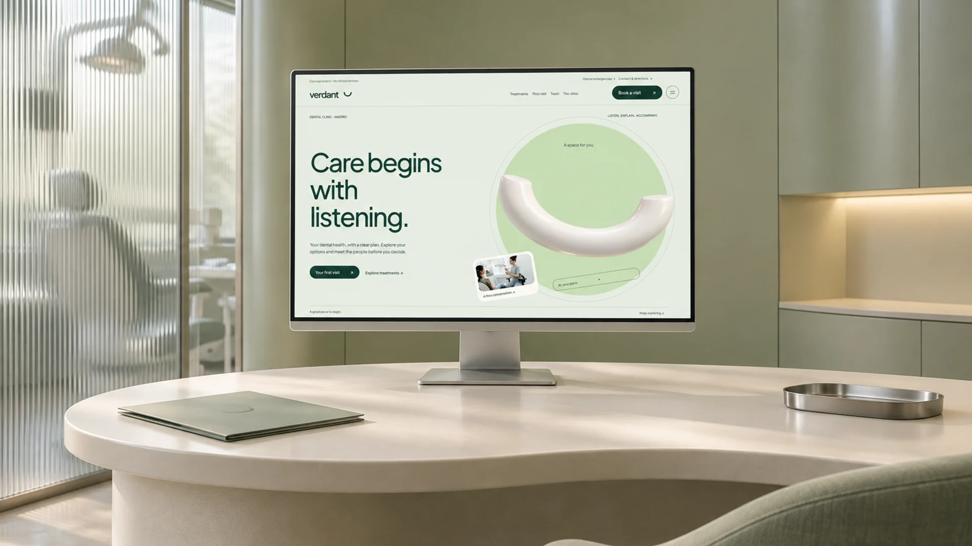 AI-generated illustrative mockup: the sage Verdant homepage on a monitor above an ivory counter in a dental consultation space.