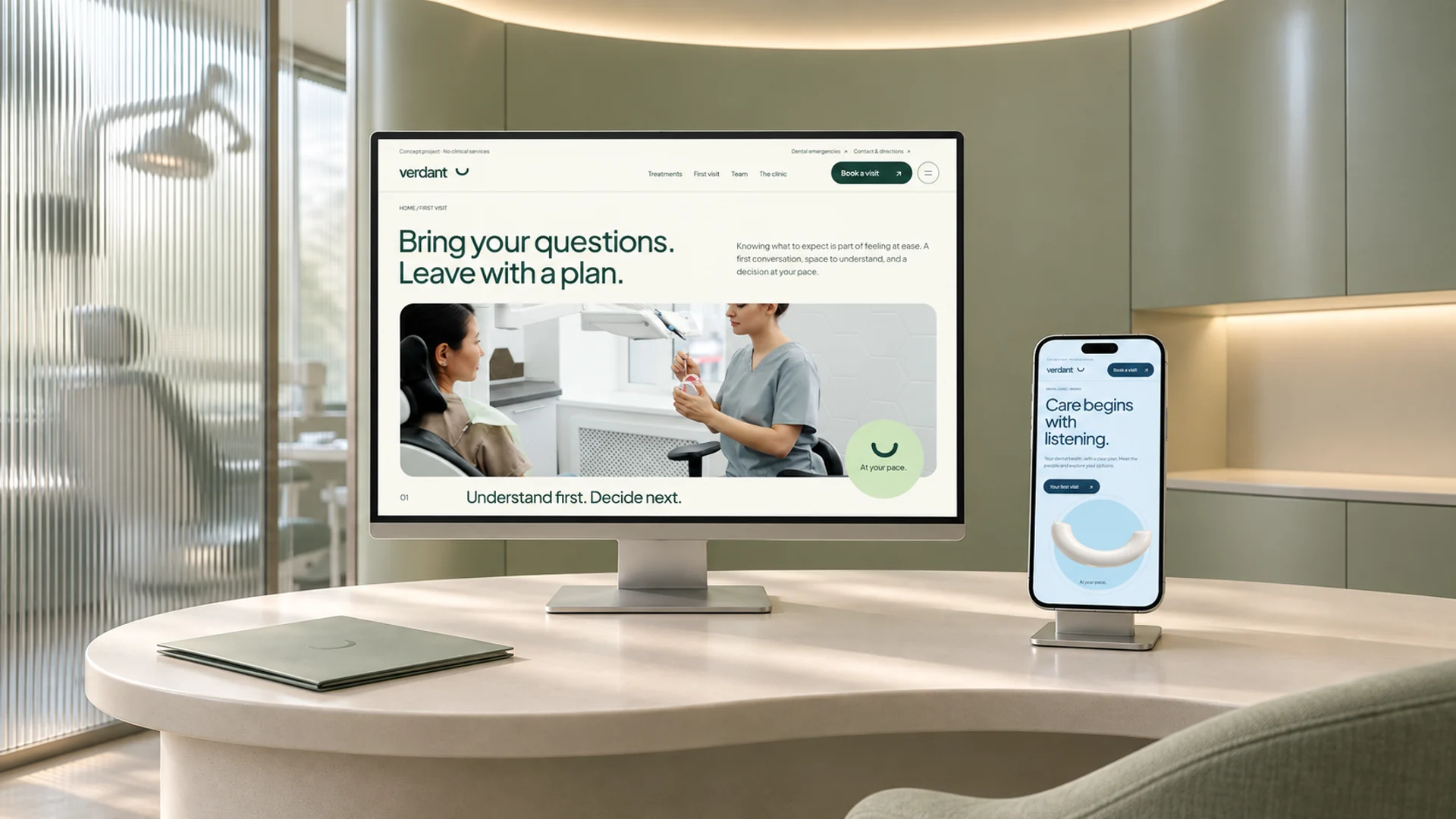 The Verdant first-visit page on a monitor and the sky-blue homepage on a separate phone, above an ivory counter. AI-generated concept scene.